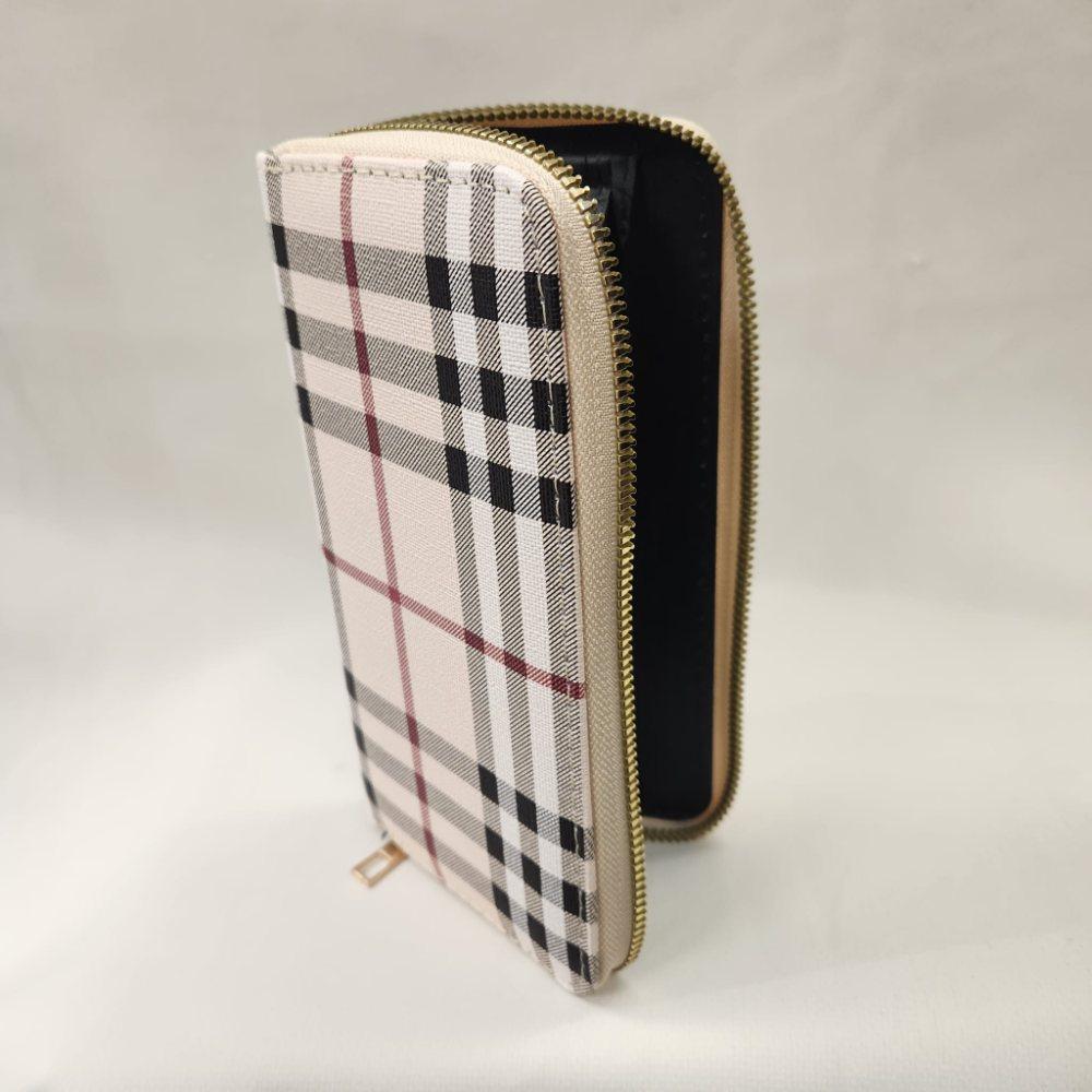 Beige plaid pattern wallet with black and brown stripes when opened