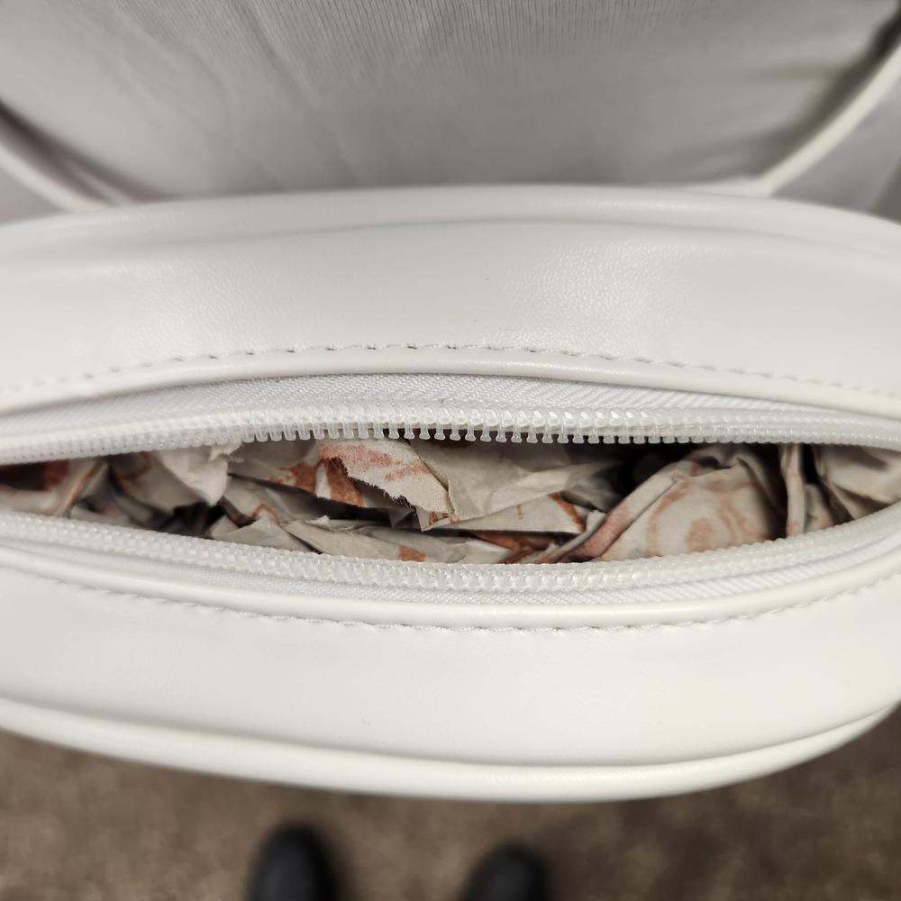 Inside view of compartment of white pouch