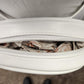 Inside view of compartment of white pouch