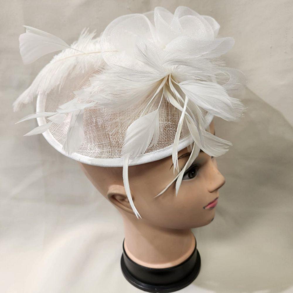 Another view of White cambric with feathers fascinator