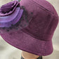 Side view of cloche hat in purple