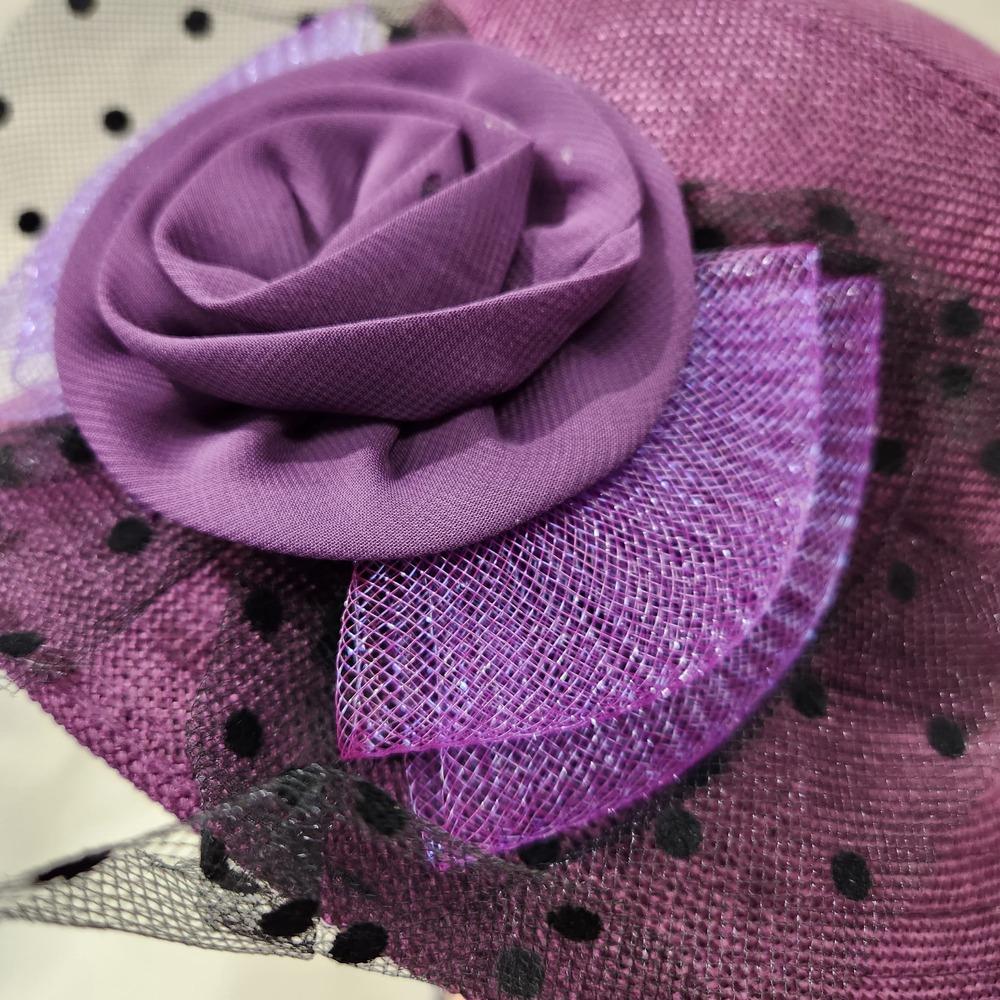 Embellishment on purple cloche hat