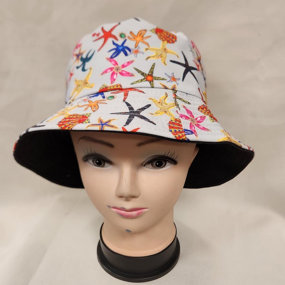 Front view of Bucket hat in beige with colorful summer print