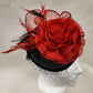 Another view of Black and red fascinator displayed on a mannequin head