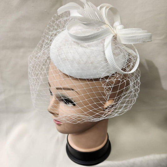 Side view of Elegant cambric fascinator in white with veil