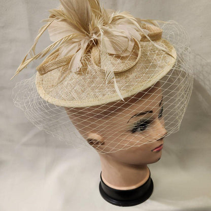Beautiful cambric fascinator in beige with veil