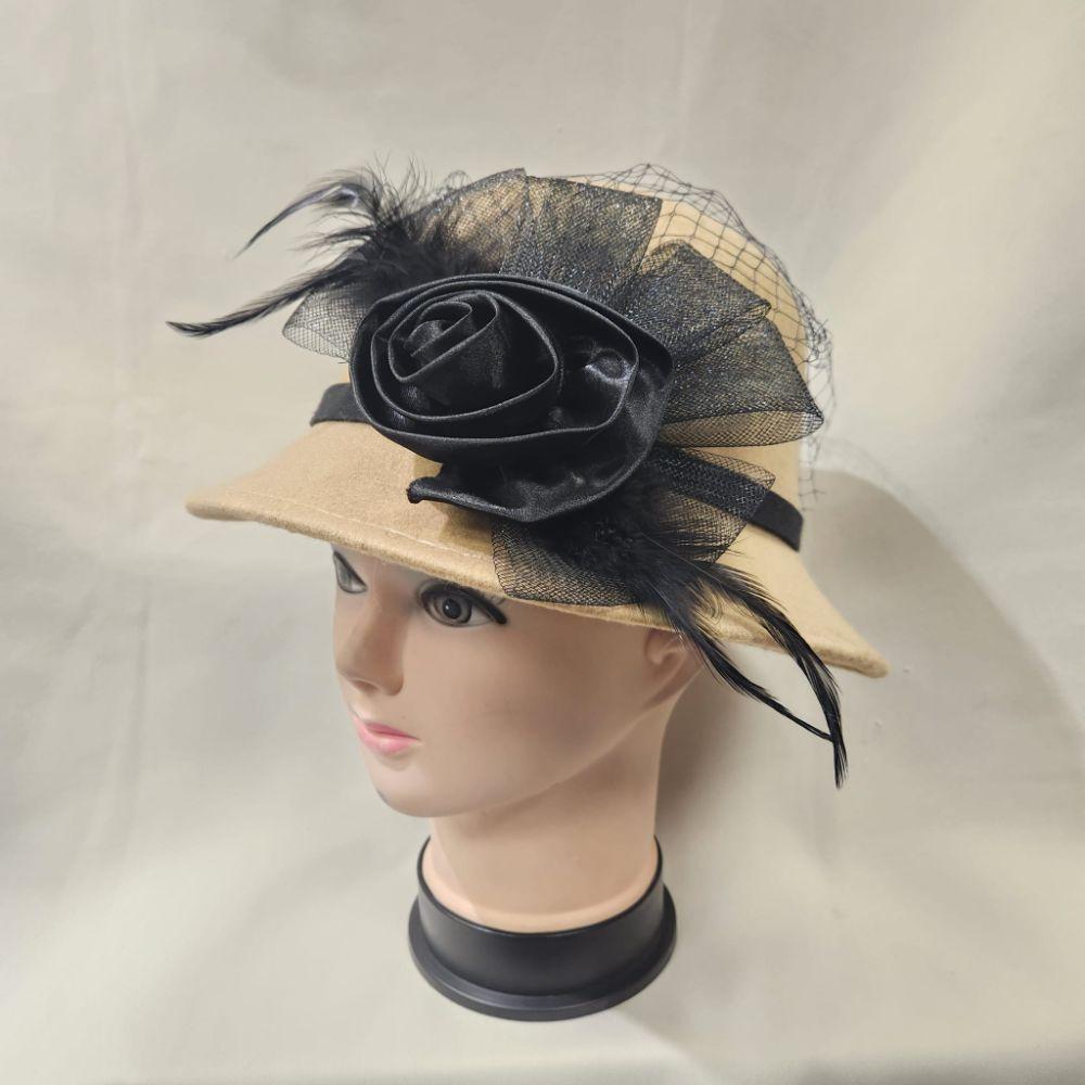 Cloche hat in beige with black mesh and ribbon detail