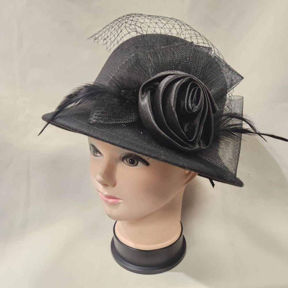 Cloche hat in black with self color mesh and ribbon detail