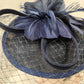 Detailed view of Navy Blue cambric fascinator with feathers and net veil