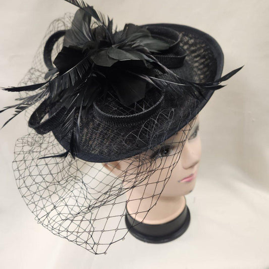Black cambric fascinator with feathers and net veil