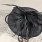 Top detailed view of Black cambric fascinator with feathers