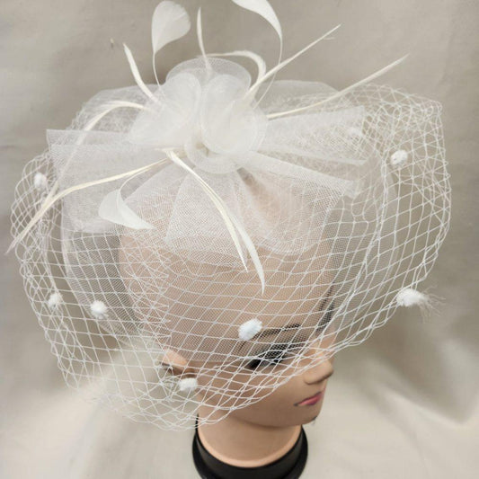 Classic fascinator in white with veil