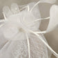 Close up view of net flower on white fascinator