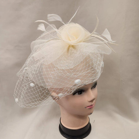 Classic cream colored fascinator with veil