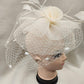 Alternative side view of Classic cream colored fascinator with veil