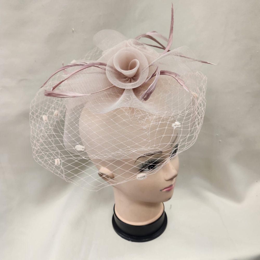Classic dusty pink fascinator with veil
