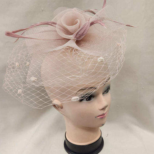 Side view of Classic dusty pink fascinator with veil
