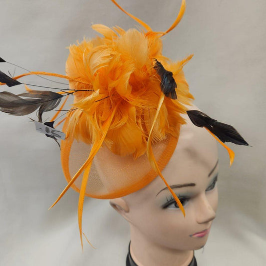 Orange fascinator with black and orange feathers