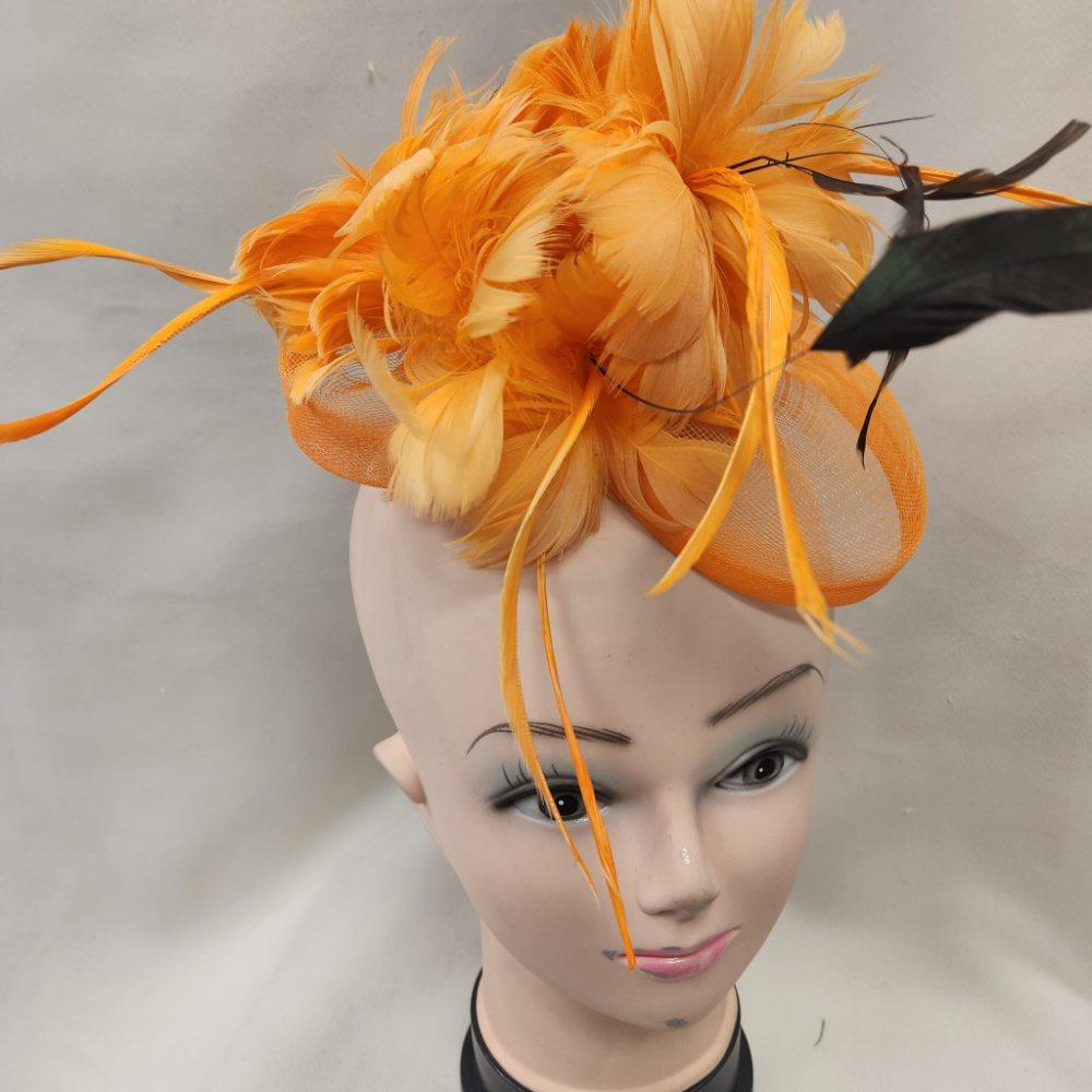 Front view of Orange fascinator with black and orange feathers