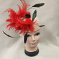 Another view of Fascinator with red and black feathers