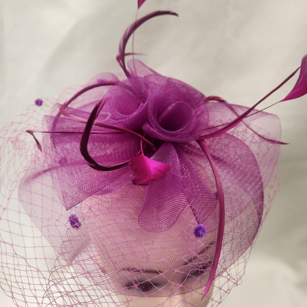 Detailed view of Classic magenta fascinator with veil
