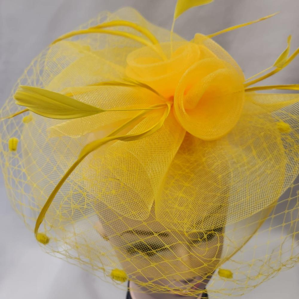 Detailed view of the front of Classic yellow fascinator with veil