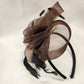 Brown fascinator with mesh and feather details