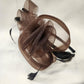 Mesh detailing of brown fascinator