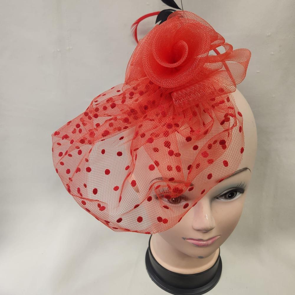 Red fascinator with mesh and feather detail 