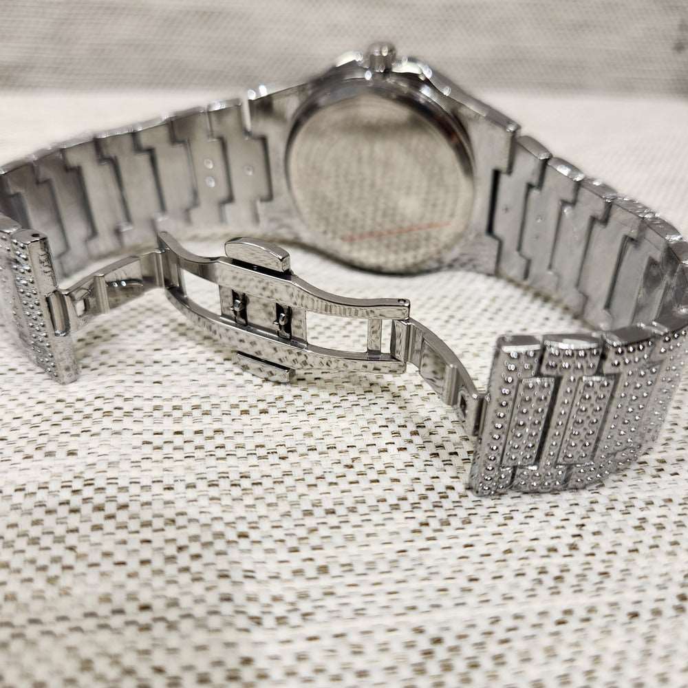 Butterfly clasp of silver color wrist watch when opened 