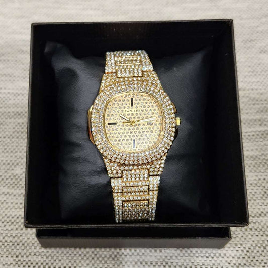 Beautiful wrist watch in gold with stone embellished strap and dial
