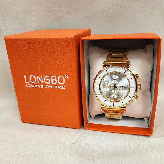 Wrist watch in gold with white round face