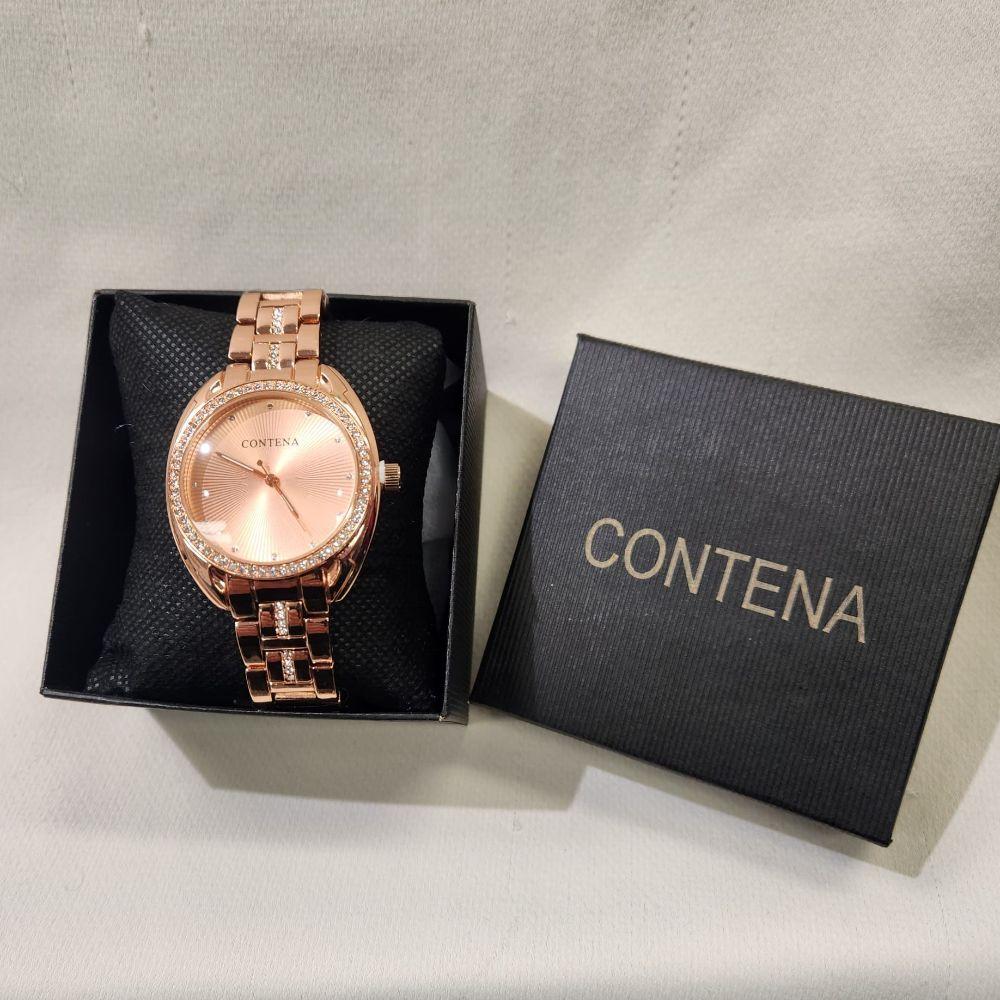 Rose gold wristwatch for women with stone studded rim