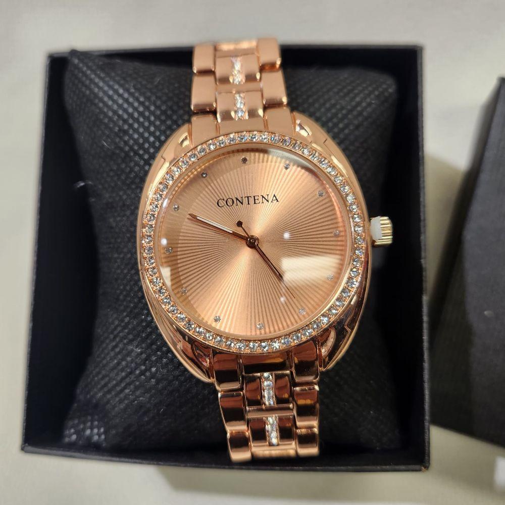 Detailed view of Rose gold wristwatch for women with stone studded rim