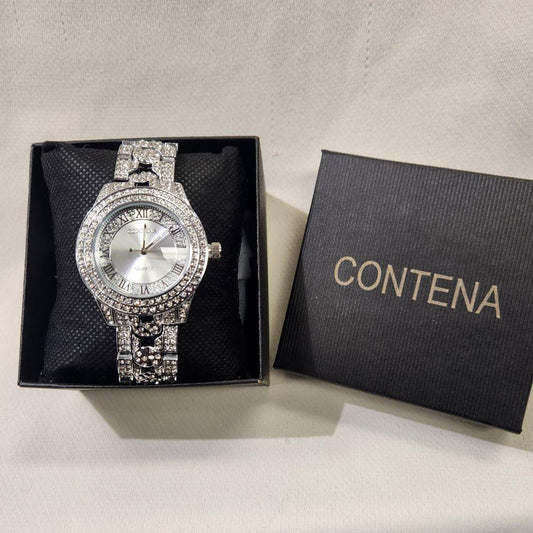 Silver color wristwatch for women with stone studded rim and strap