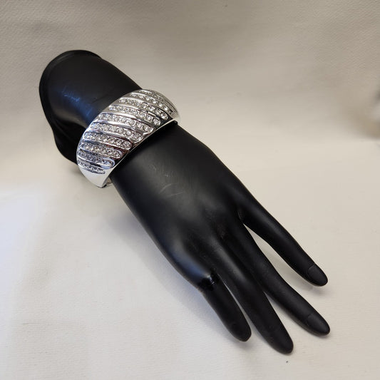 Modern silver color hinged bracelet with clear stones