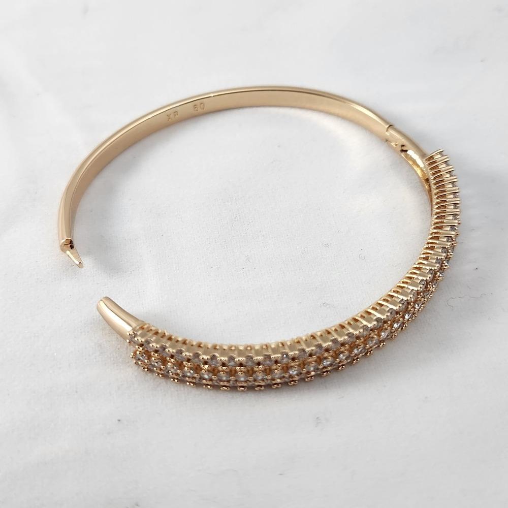 Hinged style stone studded gold bracelet