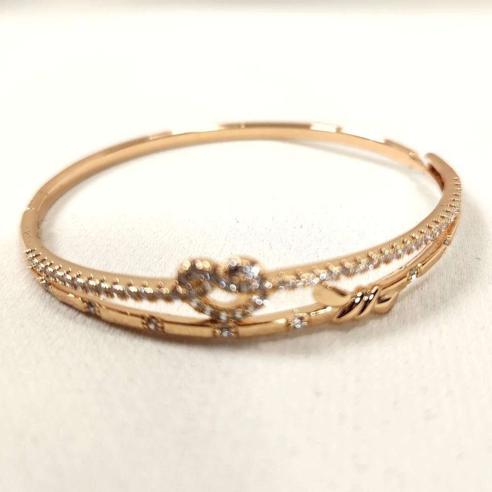 Closer view of Dainty heart & bow gold bracelet