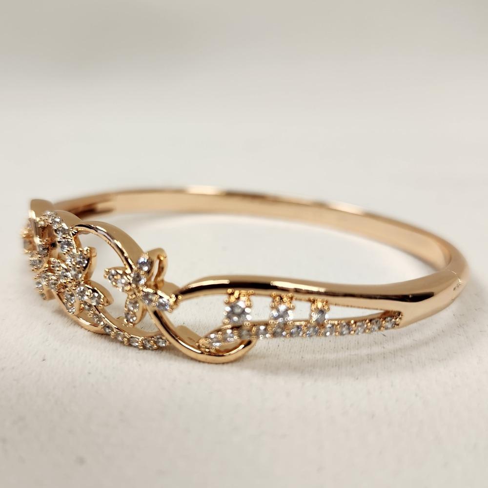 Detailed view of Dainty gold bracelet with floral design feature