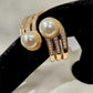 Detailed view of Elegant gold hinged bracelet with pearls