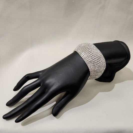 Stone studded silver bracelet with fold over clasp