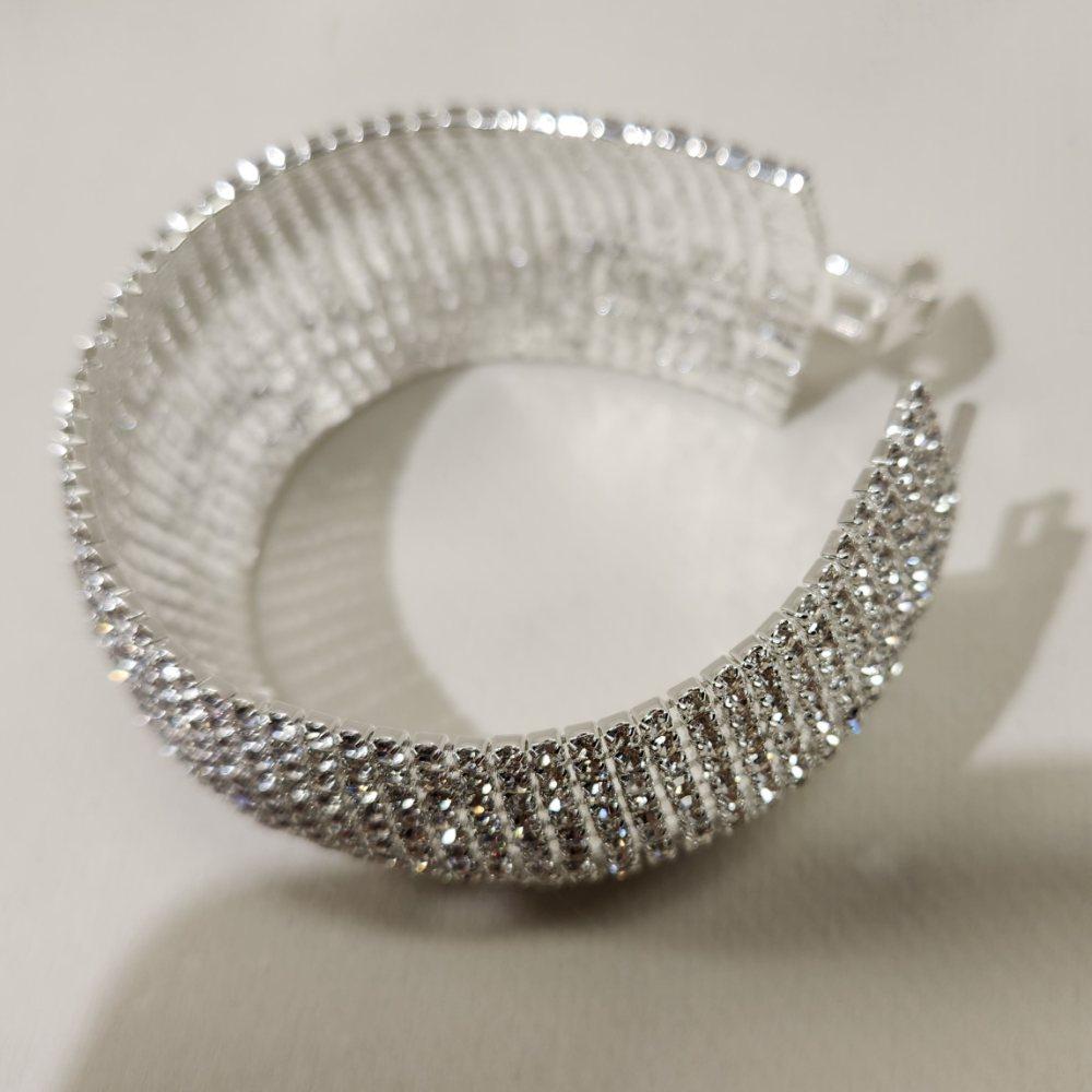 Another view of stone studded silver bracelet with fold over clasp