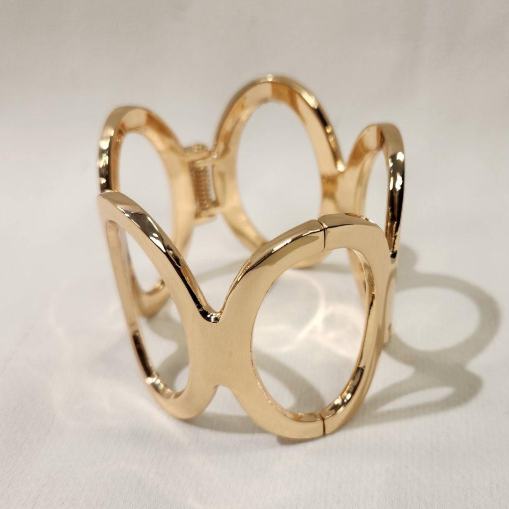 Another detailed view of gold hinged bracelet