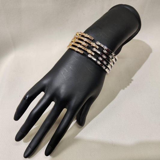 Side view of Dual tone trendy gold hinged bracelet with stones