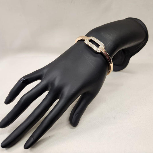 Gold bracelet with clear stones