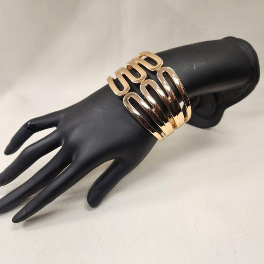 Modern broad cuff gold hinged bracelet