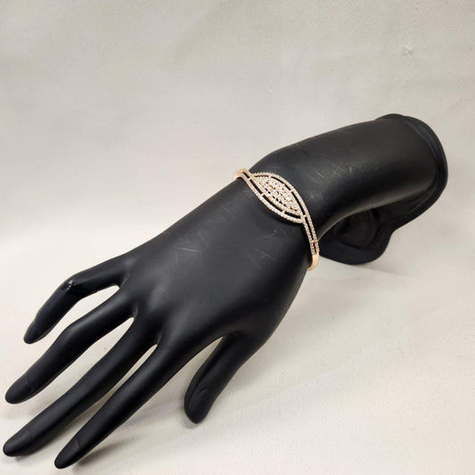 Gold bracelet with leaf shaped center piece