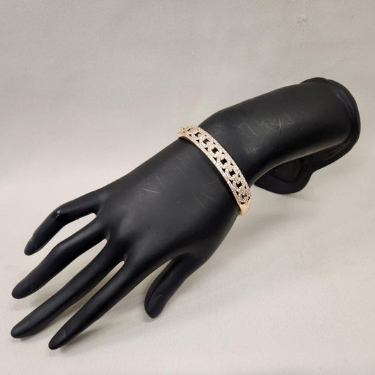 Elegant gold bracelet adorned with clear stones