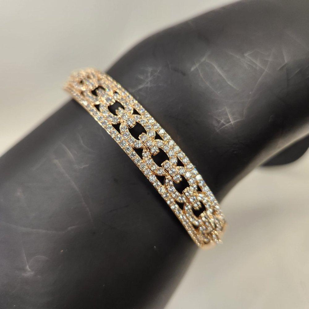 Detailed view of Elegant gold bracelet adorned with clear stones
