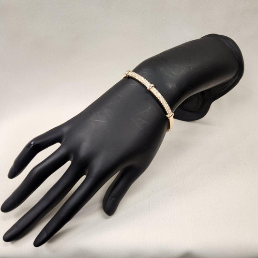 Exquisite gold bracelet adorned with clear stones